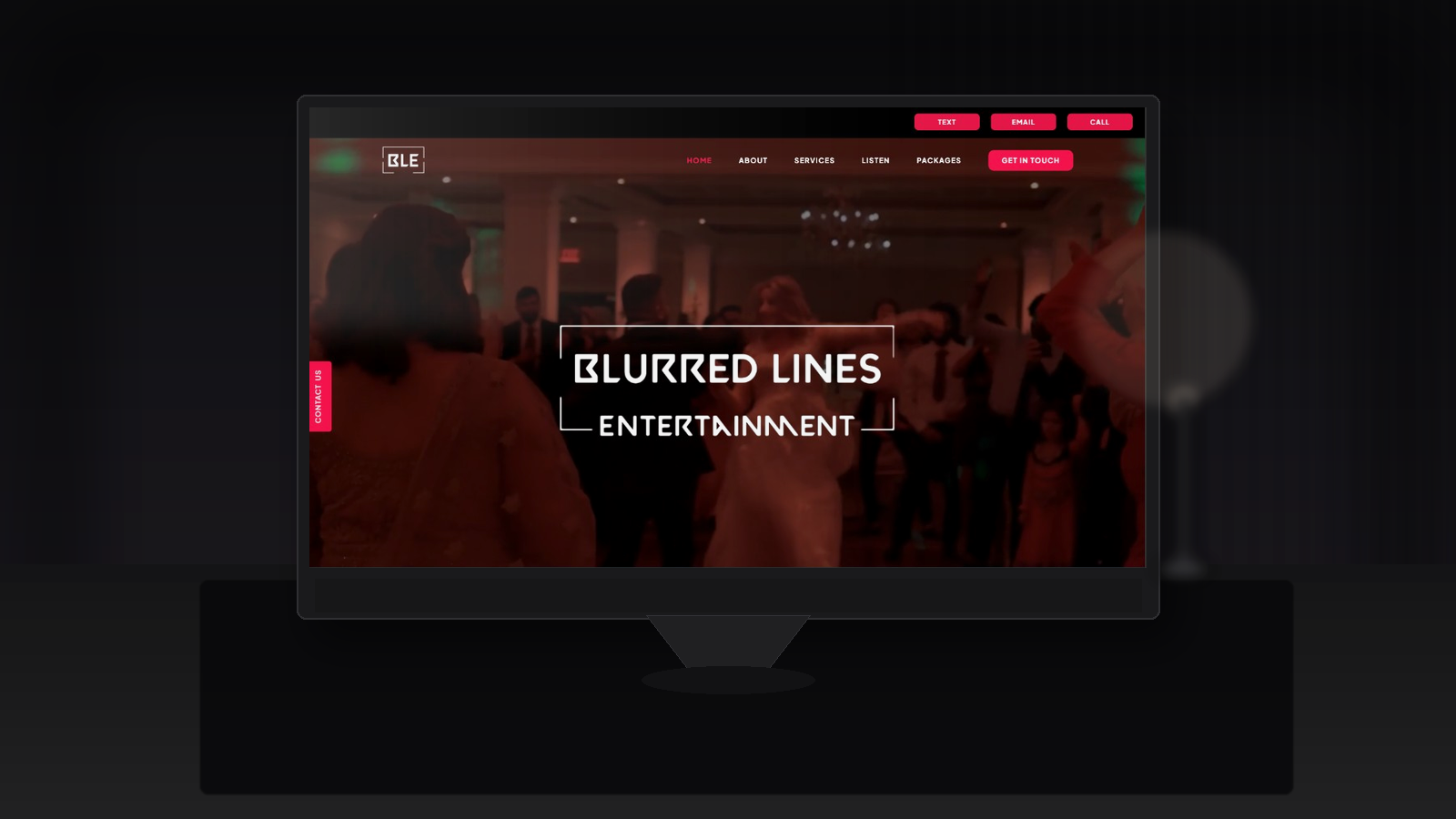 Website development — Blurred Lines Entertainment homepage mockup on screen